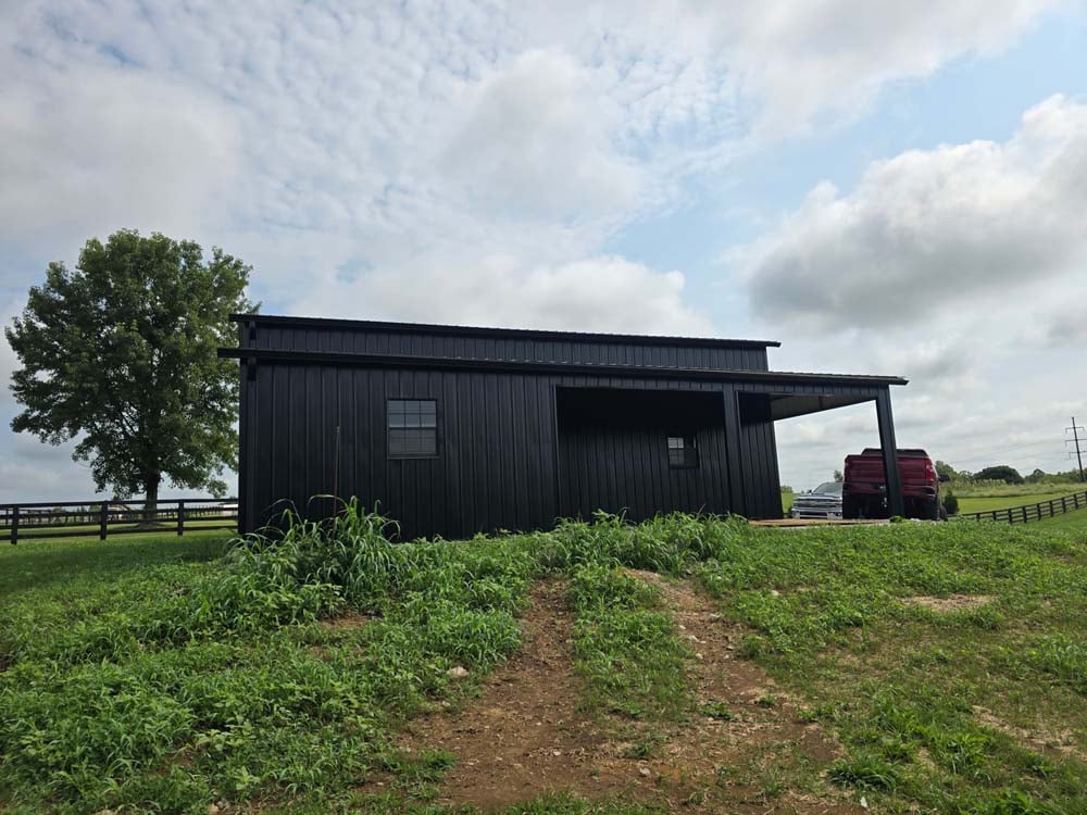 Custom home builders completing a modern rural home project with custom metal exterior finishes and quality craftsmanship.