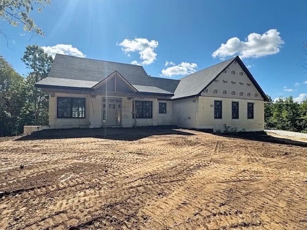 Custom home under construction featuring modern architecture, energy-efficient building materials, and quality craftsmanship by experienced custom home builders, KTF Group.