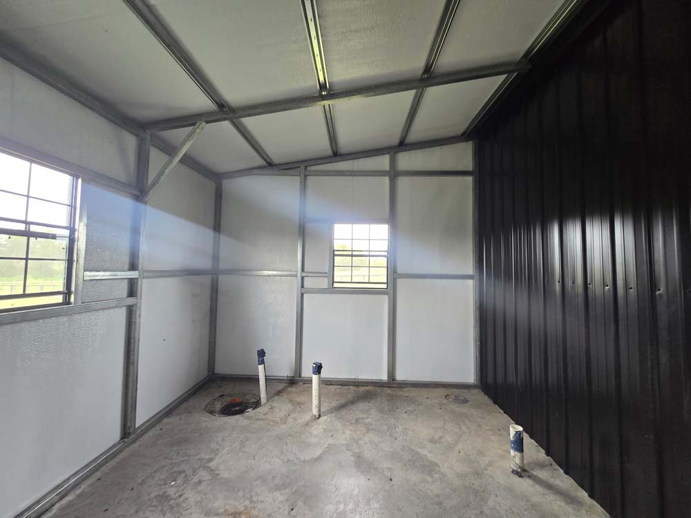 Renovation project featuring a remodeled interior space with insulated wall panels, updated finishes, and utility rough-ins ready for completion.