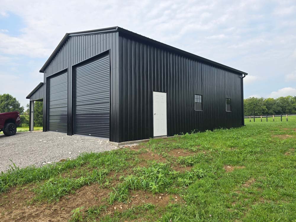 Renovation project featuring a newly upgraded metal building with modern exterior finishes, overhead doors, and improved functionality.
